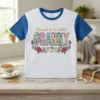 Blessed to be called GRANNY text with floral graphic on a white and blue raglan t-shirt