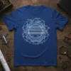 Blueprint gear graphic t-shirt featuring schematic lines, geometric shapes, and measurement marks on a blue tee