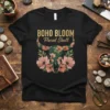 Black t-shirt with "BOHO BLOOM Floral Skull" text and a green floral skull graphic