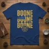 Blue t-shirt with "BOONE BOONE BOONE" printed vertically in distressed gold font, featuring a circular emblem with deer antlers and