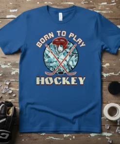 Born to Play Hockey text with crossed hockey sticks, helmet, and puck graphic on a blue t-shirt