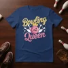 Bowling Queen text design with pink bowling ball, crown, and pins on a navy blue t-shirt