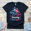 Boy or Girl Daddy loves you text with blue and pink ribbons and baby footprints graphic on a navy t-shirt