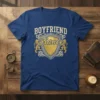 Blue t-shirt with "Boyfriend France" design in gold and white vintage lettering, featuring a shield and lions