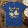 Breaking Matzah CRACK T-Shirt design featuring golden text and wheat surrounding a cracked matzah graphic