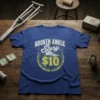 Broken Ankle Story $10 T-Shirt design with graphic of ankle bones and money symbol. Blue tee with distressed text