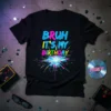 Black t-shirt with neon text "BRUH IT'S MY BIRTHDAY" and colorful retro explosion graphic