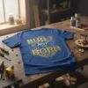 Built Not Born quote on a blue t-shirt with blueprint background and tools graphic