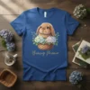 Bunny Mama t-shirt with a cute bunny in a basket surrounded by flowers, featuring gold text