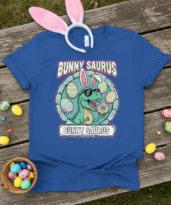 Bunny Saurus T-Shirt with a cartoon T-Rex wearing bunny ears and holding a donut, surrounded by Easter eggs