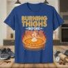 Burning Thighs Before Pies text with a pumpkin pie and flames graphic on a blue t-shirt