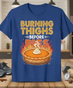 Burning Thighs Before Pies text with a pumpkin pie and flames graphic on a blue t-shirt