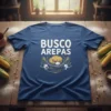 Navy blue t-shirt with "BUSCO AREPAS" in white distressed text and a graphic of arepas on a plate