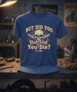Graphic t-shirt with text "But Did You Die? Est. 1980" and a skull with crossed guns design
