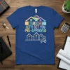 T-shirt with the text "BUT FIRST LET'S GET YOU PRE-APPROVED" in colorful distressed font, with house graphics and a key