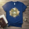 But God... quote t-shirt with golden Gothic-style lettering and a burst of light and clouds graphic