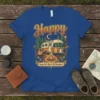 Blue t-shirt with "Happy" and "Camp Like There's No Tomorrow" text, featuring a vintage RV, campfire, guitar, and forest scene