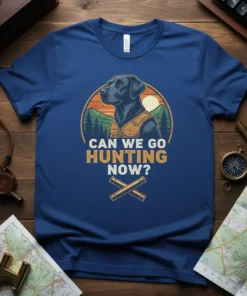 Can We Go Hunting Now? text with a black labrador retriever wearing a hunting vest, set against a mountain and