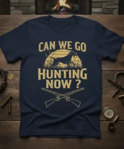 Navy blue t-shirt with distressed yellow text "CAN WE GO HUNTING NOW ?", a hunting dog silhouette, and crossed rifles
