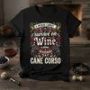 T-shirt design with text "A Woman Cannot Survive on Wine Alone. She Also Needs A Cane Corso" featuring wine grapes