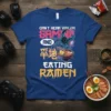 Can't Hear You I'm Gaming And Eating Ramen text with headphones and ramen bowl graphic on a blue t-shirt