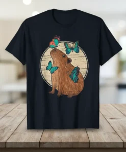Capybara butterfly design graphic on a t-shirt, featuring a brown capybara with turquoise and orange butterflies