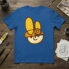 Cartoon rabbit character wearing a hat and goggles graphic on a blue t-shirt, featuring bold outlines and a painterly style