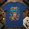 Cat playing guitar with musical notes and vibrant patterns, featuring the text "cat guitarist" on a blue t-shirt