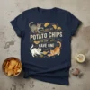 Cats Are Like Potato Chips You Can't Just Have One quote on a navy t-shirt with playful cat illustrations and