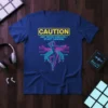 CAUTION MAY SPONTANEOUSLY START DANCING text with a neon dancer graphic on a blue t-shirt