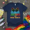 Celebrate Juneteenth and Pride Month graphic tee with fists breaking chains and rainbow colors