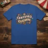 Certified Clown text with vintage circus graphics on a blue t-shirt. Features a clown face and floral elements