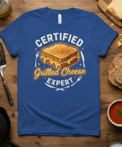 Certified Grilled Cheese Expert text with a graphic of a gooey grilled cheese sandwich and cutlery on a blue t-shirt