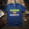 Blue t-shirt with "CHANGING my NARRATIVE." text in neon yellow, orange, and white, set against abstract geometric graphics
