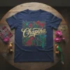 Chapina t-shirt with gold glitter text, hummingbirds, red flowers, and green quetzal bird graphic