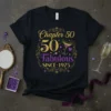 Black t-shirt with "Chapter 50 50 Fabulous SINCE 1975" in gold and purple glitter text, featuring a martini glass graphic