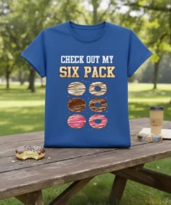 Blue t-shirt with "Check Out My Six Pack" text above six colorful donuts graphic