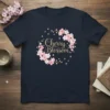 Navy t-shirt with glitter gold text "Cherry Blossom" surrounded by a pink and white cherry blossom flower wreath