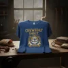 Chewsday Innit text and bulldog graphic on a blue t-shirt, featuring a crown and a bone