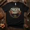 Chicken Daddy t-shirt with a vintage design featuring roosters, a small chicken coop, and the text "CHICKEN DADDY"