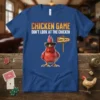 Blue t-shirt with "Chicken Game Don't Look At The Chicken Game Over" text and a sunglasses-wearing chicken graphic
