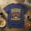 Navy t-shirt with "CHICKEN THE PET THAT POOPS BREAKFAST" text, featuring two roosters and a fried egg graphic