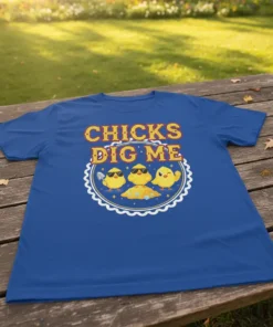 Chicks Dig Me T-Shirt featuring three cartoon chicks, one wearing sunglasses and digging, with bold yellow and red text
