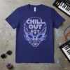 Geometric alien head design with "CHILL OUT" text, celestial stars, and geometric symbols on a navy blue t-shirt