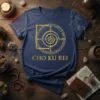 Navy blue t-shirt with gold glitter "CHO KU REI" text and a circular reiki symbol featuring runes and a spiral
