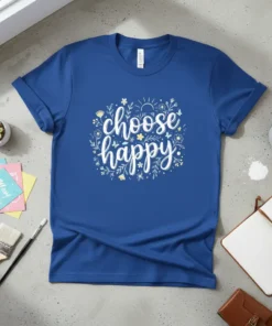 Blue t-shirt with white and yellow "choose happy" script text surrounded by floral and sun graphics