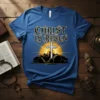Christ Is Risen t-shirt with a white cross, mountains, and sunrise graphic. Religious Easter apparel