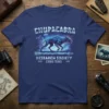 Chupacabra Research Society Cuero Texas t-shirt design featuring a blue cryptid creature, UFOs, and lightning arrows