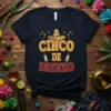 Cinco De Drinko t-shirt design with sombrero, maracas, and tequila bottles in a vintage distressed style