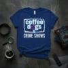 T-shirt with "coffee dogs & CRIME SHOWS" text in white and blue, featuring a dog silhouette graphic